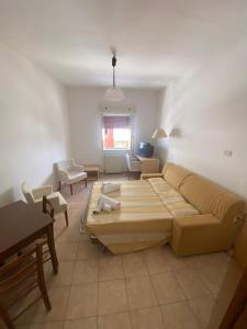 a living room with a couch and a table at L'Ostello in Vasto