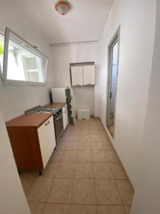 a kitchen with a sink and a counter in a room at L'Ostello in Vasto