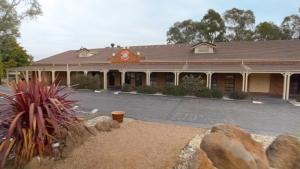 a building with a clock on the front of it at Mercure Port of Echuca in Echuca