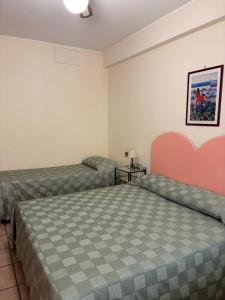 Postel nebo postele na pokoji v ubytování La Grotta