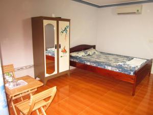 Giường trong phòng chung tại Hong Chau Guesthouse