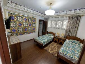 Кровать или кровати в номере Hotel Gulnaraxanum Boutique This hotel is nearby the center of the old city Every room decorated in the unique style