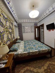 Кровать или кровати в номере Hotel Gulnaraxanum Boutique This hotel is nearby the center of the old city Every room decorated in the unique style