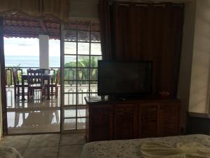 TV a/nebo společenská místnost v ubytování Hotel Coco Beach