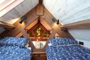 two beds in the attic of a house at Tannery Cottage Porlock in Porlock