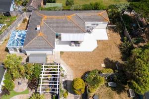 an overhead view of a house with a roof at 3-Bed Beach Bungalow & Garden 150m to Sea in West Wittering