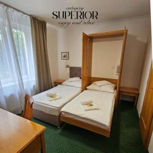 Posteľ alebo postele v izbe v ubytovaní Hotel Claris