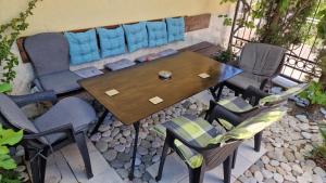 a table and chairs and a couch on a patio at Sunset Villa in Bar