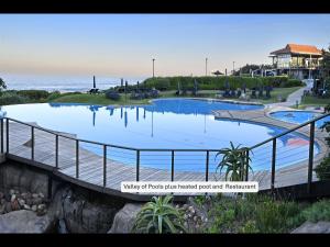 a view of a swimming pool at a resort at 13 Yellowwood - with back-up power in Ballito