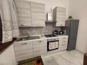 Kuchyň nebo kuchyňský kout v ubytování Villa ORCHIDEA + 9 fotografií