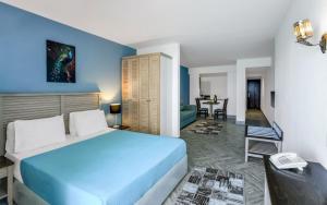 a hotel room with a bed and a table at Hostmark Blue Beach Hotel in Marsa Matruh +39 photos