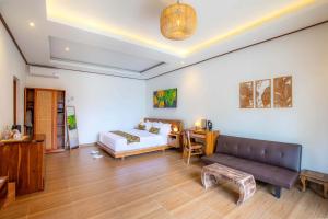 Voodi või voodid majutusasutuse Uma Nandhi Villa Ubud toas