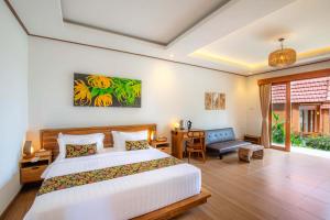 Voodi või voodid majutusasutuse Uma Nandhi Villa Ubud toas