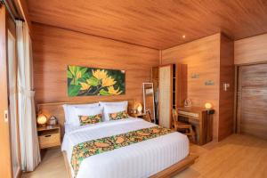 Voodi või voodid majutusasutuse Uma Nandhi Villa Ubud toas