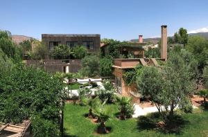 an aerial view of a house with a yard with trees at Domaine Malika - Adults Only in Ouirgane
