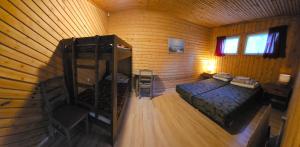 an overhead view of a room with a bed and a ladder at Viitna Puhkekeskus in Viitna