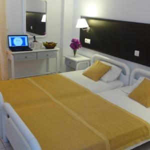 Postel nebo postele na pokoji v ubytování Blue Nest Hotel