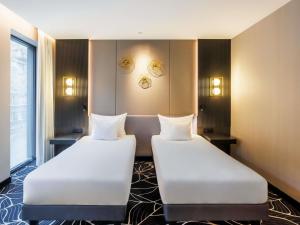 Movenpick Hotel Tallinn客房内的一张或多张床位