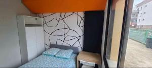 Ένα ή περισσότερα κρεβάτια σε δωμάτιο στο Chambre Privée dans appartement partagé CHO