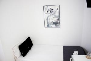 TV a/nebo společenská místnost v ubytování Petit Hotel