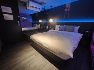 Postel nebo postele na pokoji v ubytování Goldinn Hotel
