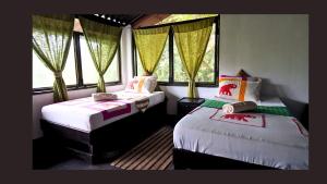 Ένα ή περισσότερα κρεβάτια σε δωμάτιο στο Sigiriya Eco Lodge & Accommodation - Sigiriya CES Field Base