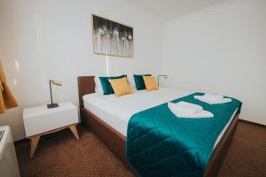 Rúm í herbergi á Hotel Brcko Gas Doboj