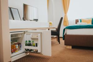 Rúm í herbergi á Hotel Brcko Gas Doboj