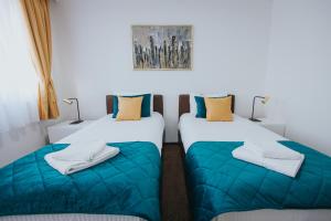 Rúm í herbergi á Hotel Brcko Gas Doboj
