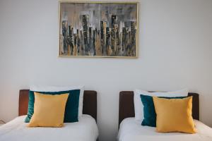 Rúm í herbergi á Hotel Brcko Gas Doboj