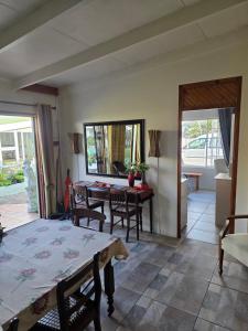 a room with a table and chairs and a dining room at Knysna Self Catering Accommodation in Knysna