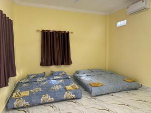Katil atau katil-katil dalam bilik di Lazy Mango Home Stay