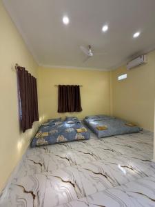 Katil atau katil-katil dalam bilik di Lazy Mango Home Stay