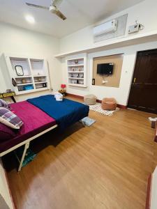 a bedroom with a large bed in a room at THS Home Stay in Varanasi +10 photos