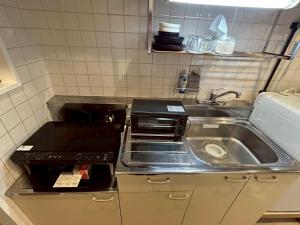 Η κουζίνα ή μικρή κουζίνα στο GuestHouseAQUA101