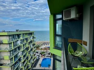 a view of the ocean from a balcony of a building at Allezzi Resort Mamaia Nord D 13 in Mamaia