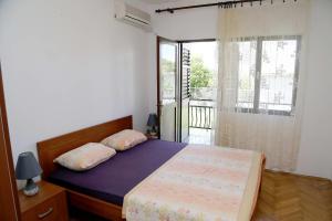 Postelja oz. postelje v sobi nastanitve Apartments Stevo Nikočević
