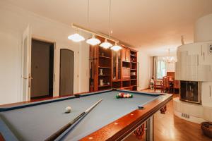 a pool table in a living room with at Ferienhaus mit Disco, Whirlpool und vielem mehr in Oed