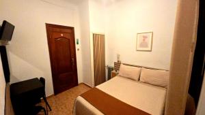 Postel nebo postele na pokoji v ubytování Hostal Prada