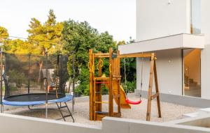 a playground with a slide and a trampoline at VILLA MON AMOUR by Villas Guide in Blato