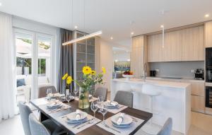 a kitchen and dining room with a table and chairs at VILLA MON AMOUR by Villas Guide in Blato