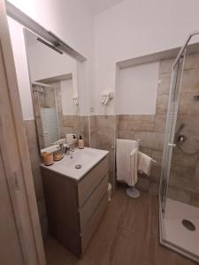 a bathroom with a sink and a shower at B&B li salcuneddi in Aglientu +42 photos