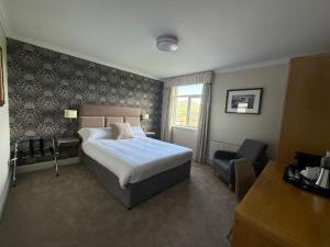 Letto o letti in una camera di Ring of Kerry Hotel