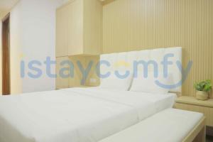 a white bed with a sign that says isclaw camp at Studio Pollux Habibie B1617 City View in Batam Center
