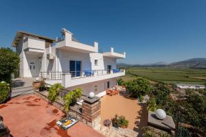 an aerial view of a villa with a view at Fjori's Apartments in Sarandë
