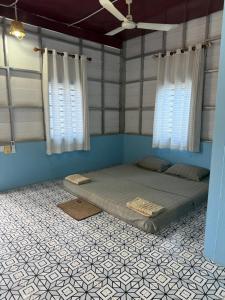 Katil atau katil-katil dalam bilik di Lazy Mango Home Stay
