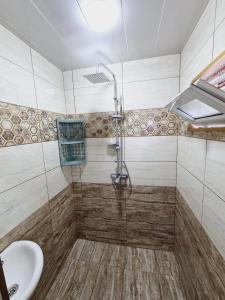 a bathroom with a shower and a sink at Aksn new small villa in Gabala +17 photos