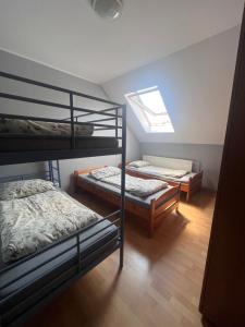 Postel nebo postele na pokoji v ubytování Sport Kompleks