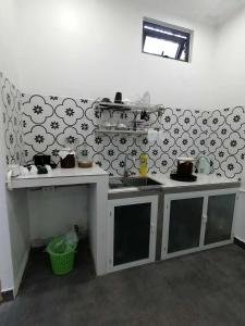a kitchen with a counter and a sink in a room at Orange Beach House in Phú Quí (2)