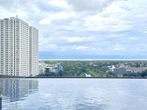 a large body of water in front of a building at Charming 2BR Apartment at Amor Pakuwon City Mall East Surabaya by Le Ciel Hospitality in Surabaya